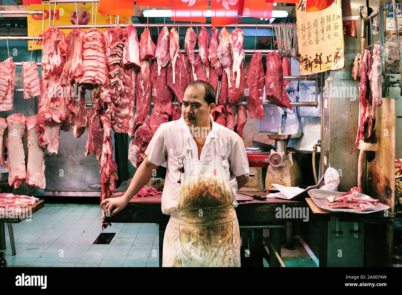 Butcher at Bowrington Road Wet Market, Wanchai, Hong Kong Stock Photo