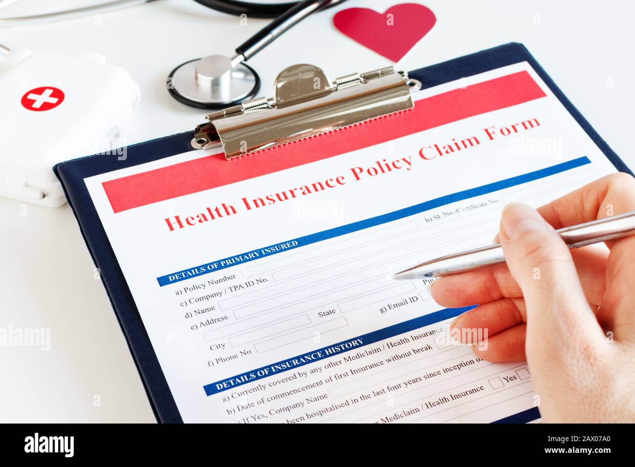 Blank health insurance policy claim form with stethoscope on clipboard