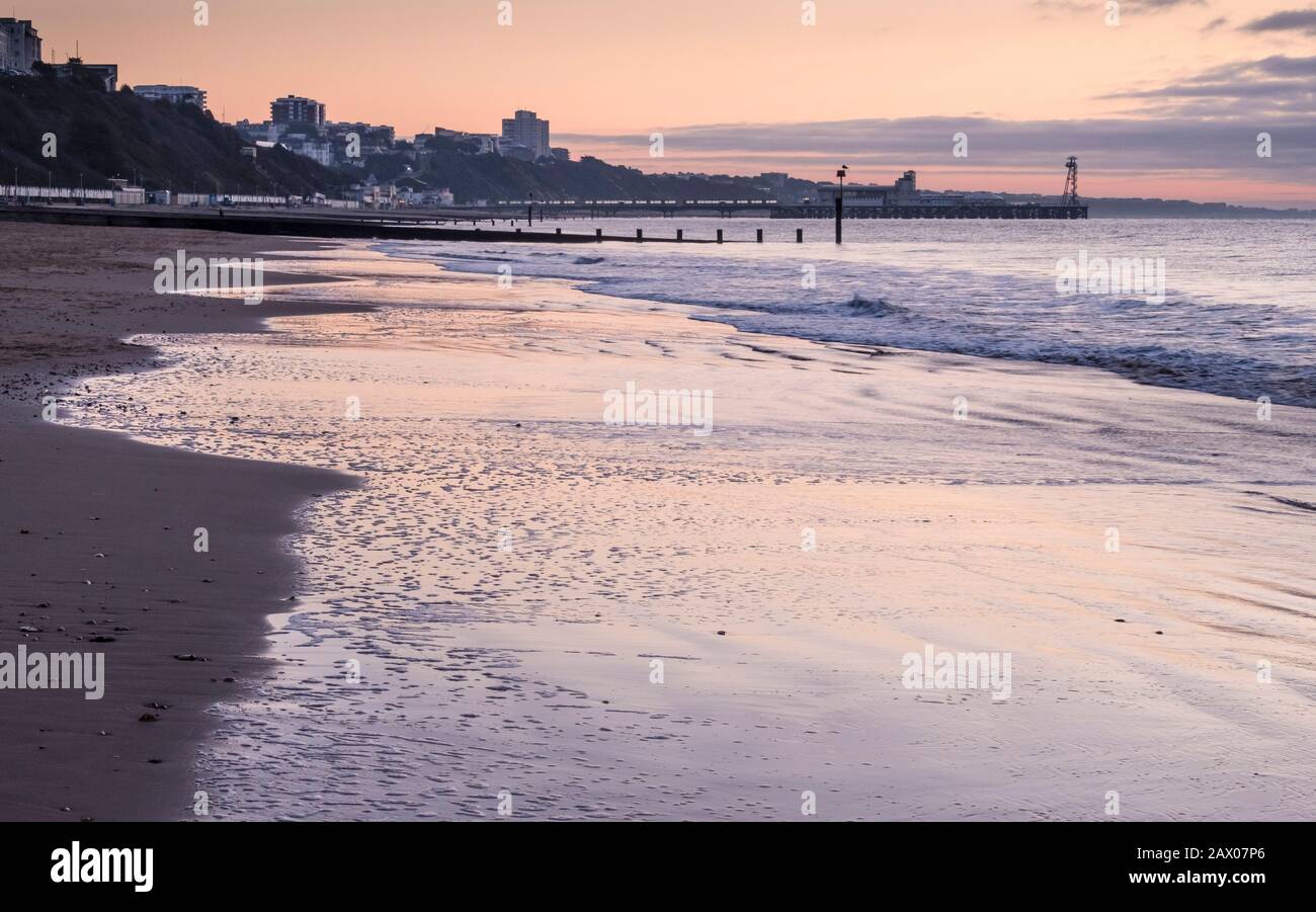 Dawn Breaking over a Bournemouth Beach and Poole Bay Stock Photo