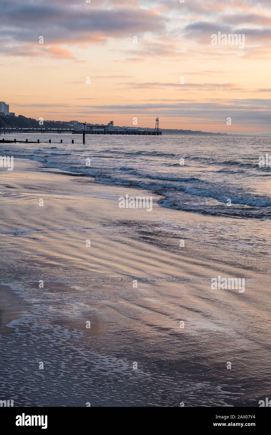 Dawn Breaking over a Bournemouth Beach and Poole Bay Stock Photo