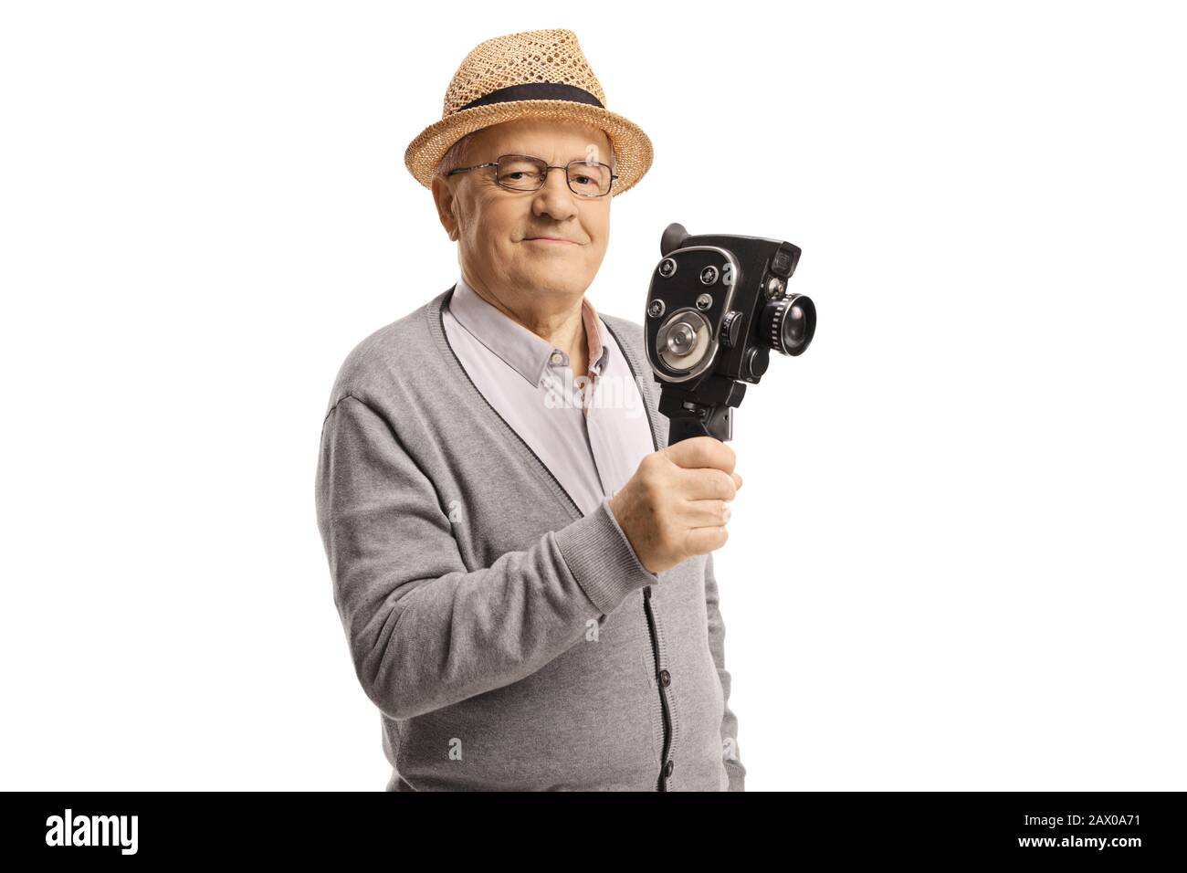 Mature gentleman holding an 8mm vintage recording camera isolated on white background Stock Photo