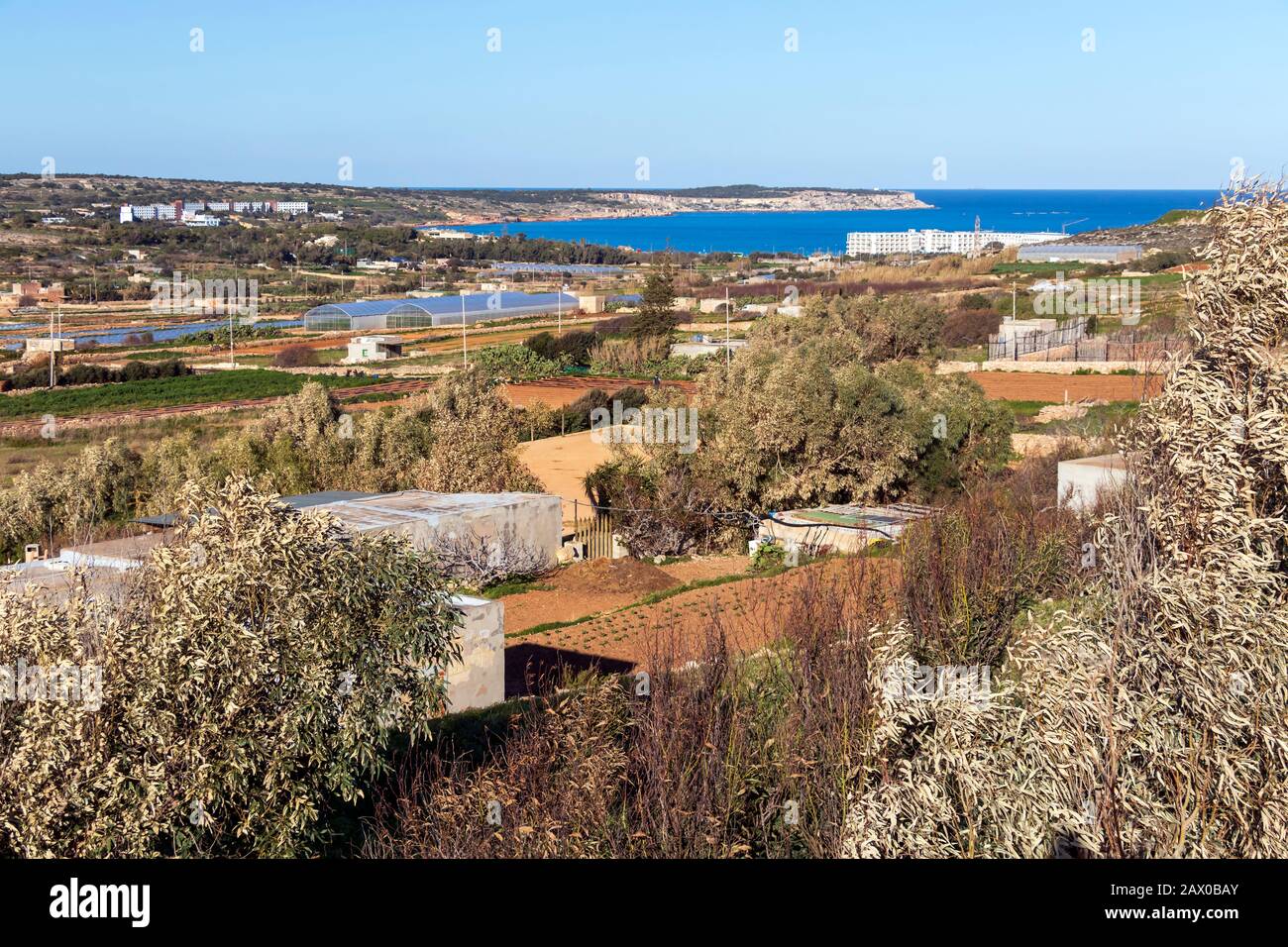 Rural Countryside Of Maltese Island With Dry Vegetation Crop Fields Plowed Land And Blue Water Of The Mediterranean Sea Bay In The Background Malta Stock Photo Alamy