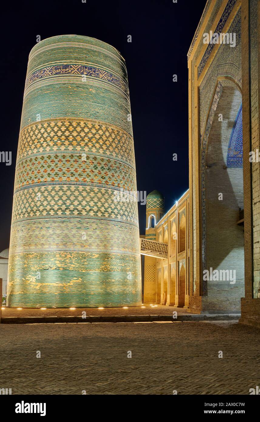 illuminated Kalta Minor Minaret at night, Itchan-Kala, Khiva, Uzbekistan, Central Asia Stock Photo