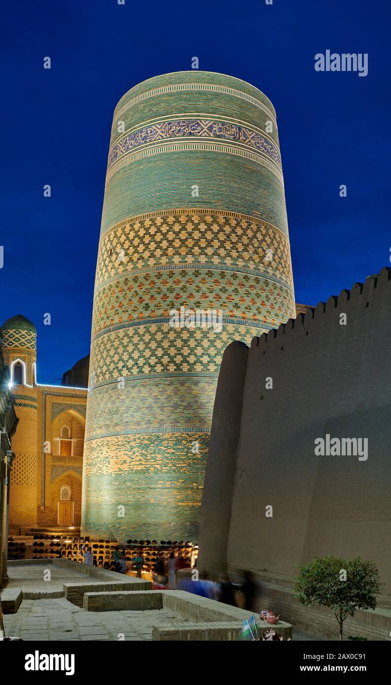 illuminated Kalta Minor Minaret at night, Itchan-Kala, Khiva, Uzbekistan, Central Asia Stock Photo