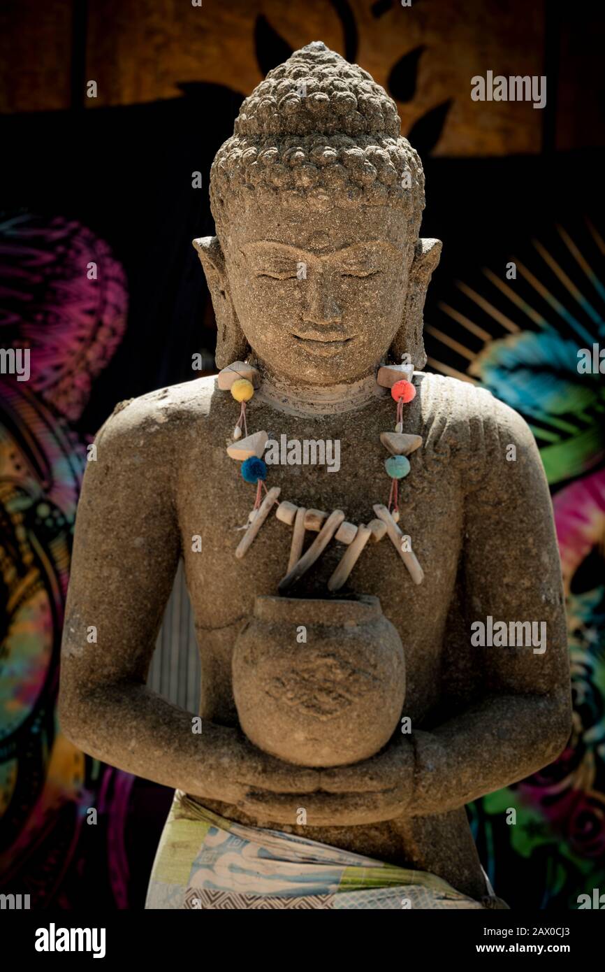 Buddha statue outdoor in sunlight with colourful background Stock Photo ...