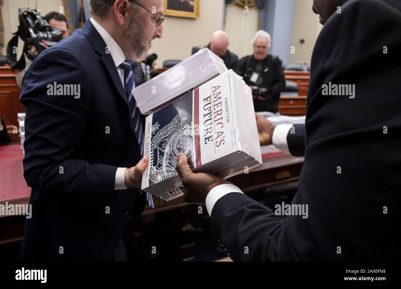 Washington, United States. 10th Feb, 2020. Members of the Government Printing Office upload copies of President Donald Trump's proposed FY2021 Budget on Capitol Hill, in Washington, DC on Monday, February 10, 2020. The budgets propose $4.4 trillion in spending cuts over the next decade, include reducing foreign aid by 21%. Photo by Kevin Dietsch/UPI Credit: UPI/Alamy Live News Stock Photo