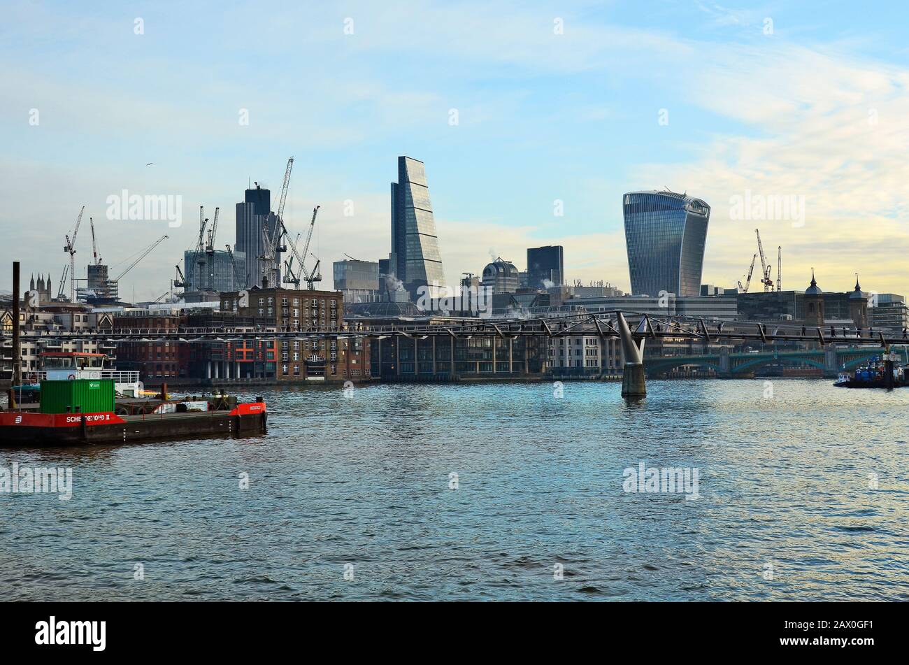 London, United Kingdom - January 19th 2016: Millenium bridge over river Thames and Leadenhall building aka Cheese Grater and Sky Garden Building aka W Stock Photo
