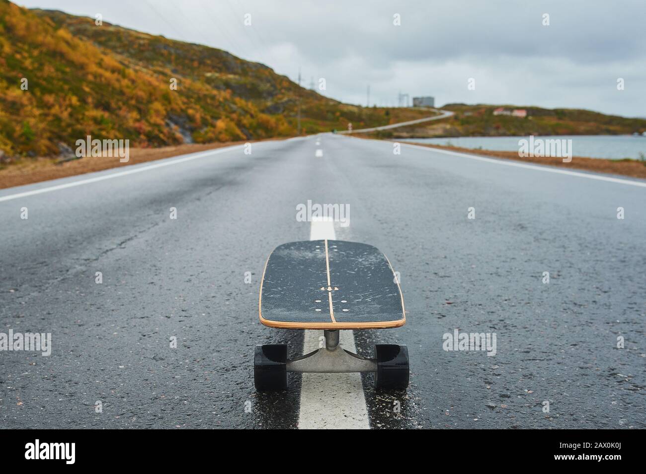 a skateboard on the road beautiful view Stock Photo - Alamy
