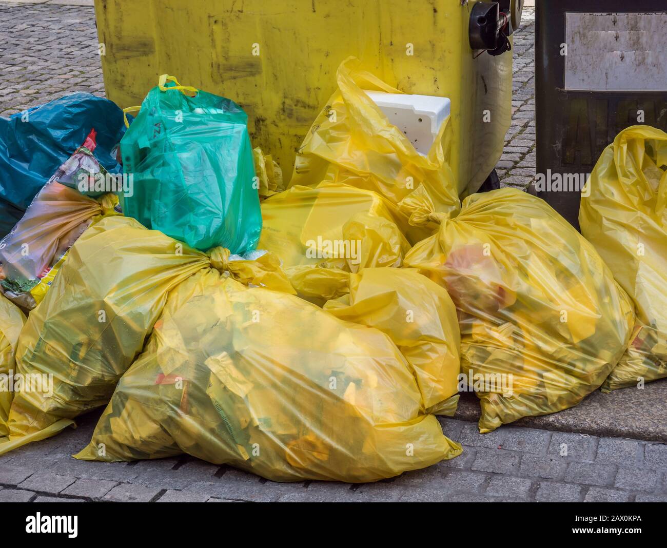 Yellow bags full of plastic waste Stock Photo - Alamy