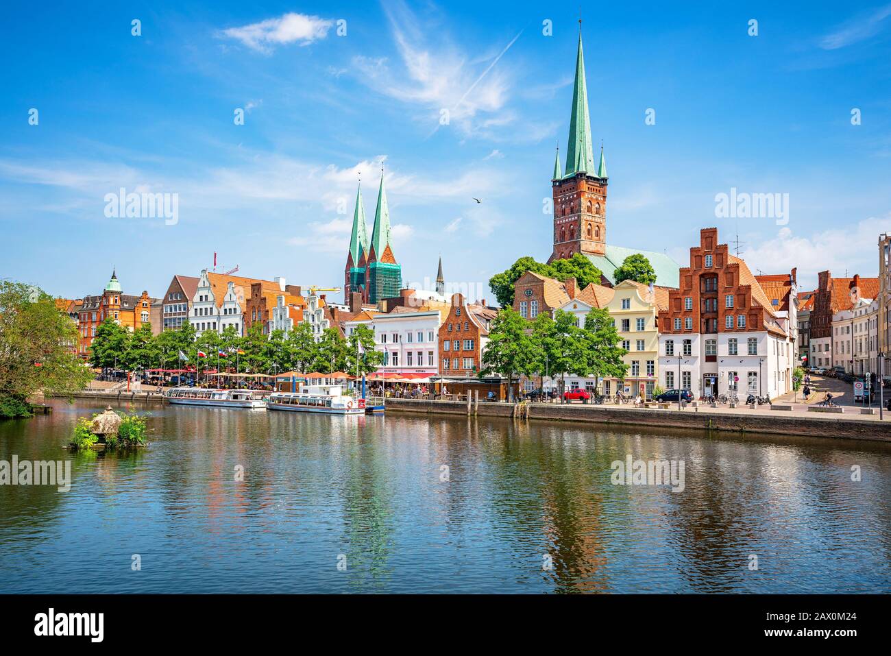 Classic view of historic skyline of hanseatic town of Lübeck with famous St. Mary's Church on a beautiful sunny day with blue sky in summer, Germany Stock Photo