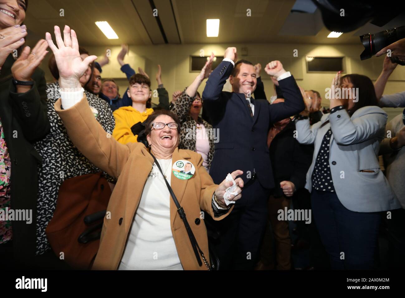 Dublin, Ireland. 9th Feb, 2020. General Election 2020. Counting of votes. Man of the moment Paul Donnelly of Sinn Fein celebrates with his mother Bridie (left), and family and supporters after being elected on the first count in the count centre in the Phibblestown Community Centre in Dublin West. He came in ahead of the Taoiseach Leo Varadkar, who was only elected on the 5th count. Photo: Eamonn Farrell/RollingNews.ie/Alamy Live News Credit: RollingNews.ie/Alamy Live News Stock Photo