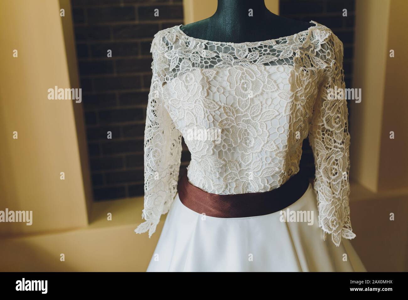Modern white wedding dress isolated on Grey background Stock Photo - Alamy