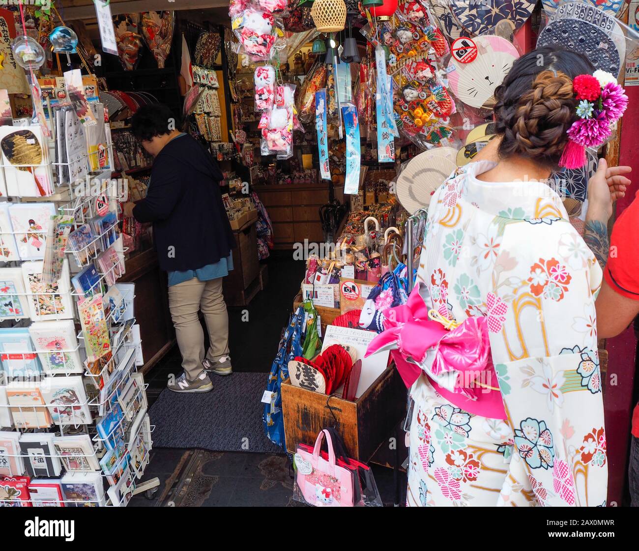 Tokyo, Japan - 10 Oct 2018:  Tourists are shopping at a crowded souvenir booth at Tokyo's Asakusa temple district. Stock Photo