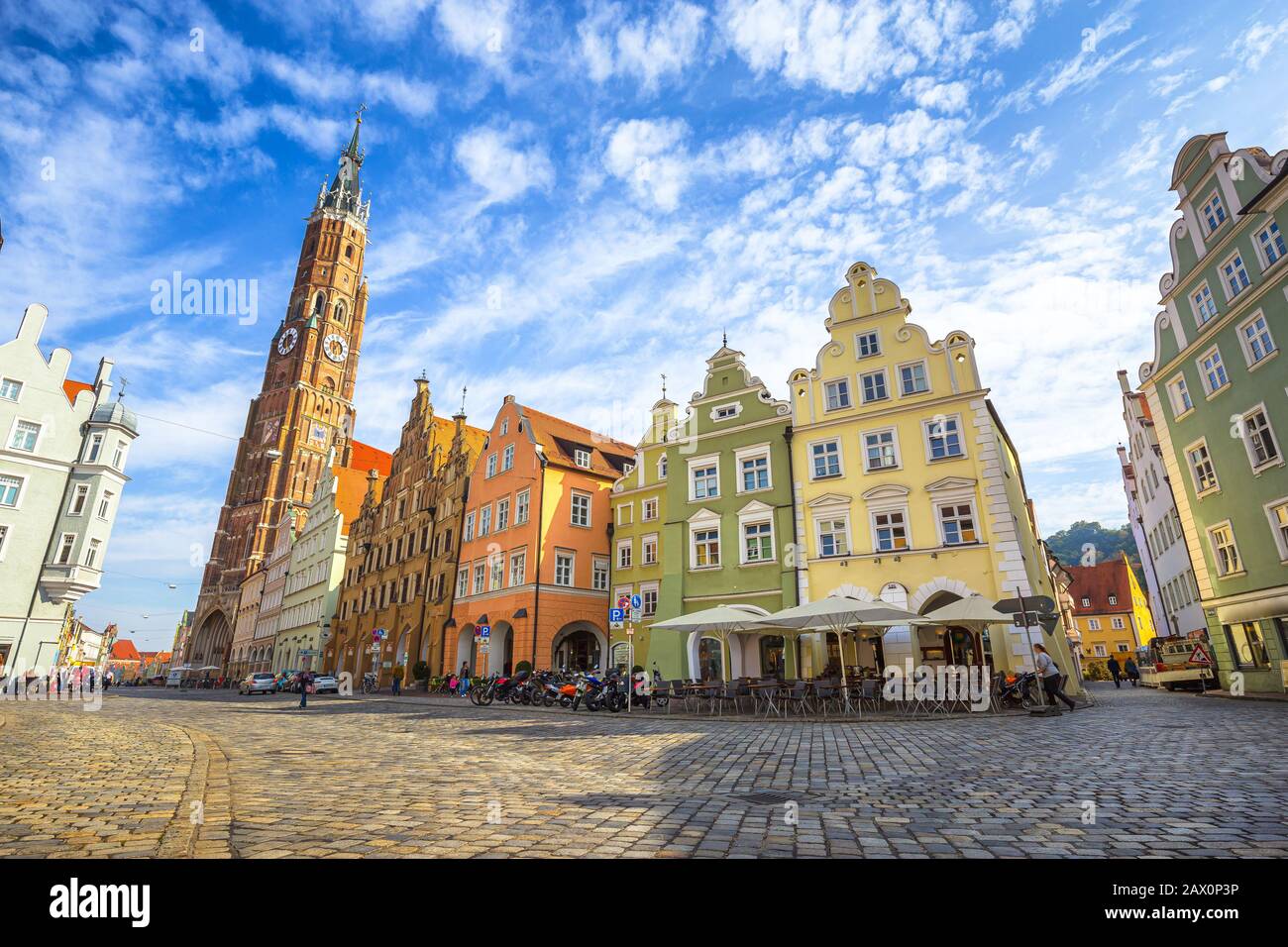 Scenic panoramic view of historic town of Landshut with traditional colorful houses and famous St. Martin's Church on a beautiful sunny day, Germany Stock Photo