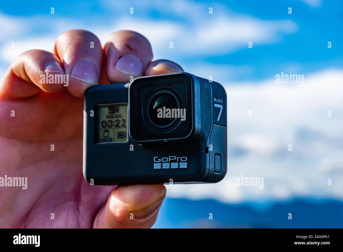 Lucéram, France - February 2, 2020: A man holding a HERO7 Black GoPro  camera taking a video of the mountain landscape during a hike Stock Photo -  Alamy