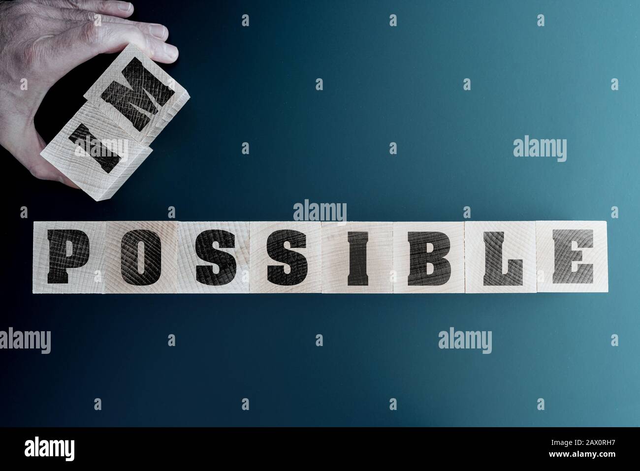 changing word impossible to impossible on wooden blocks, motivation and inspiration concept Stock Photo