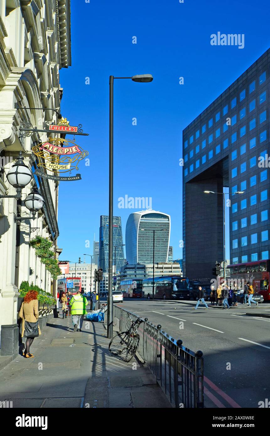 London, United Kingdom - January 15th 2016: Unidentified people and building with sky garden and Leadenhall building aka cheese grater Stock Photo