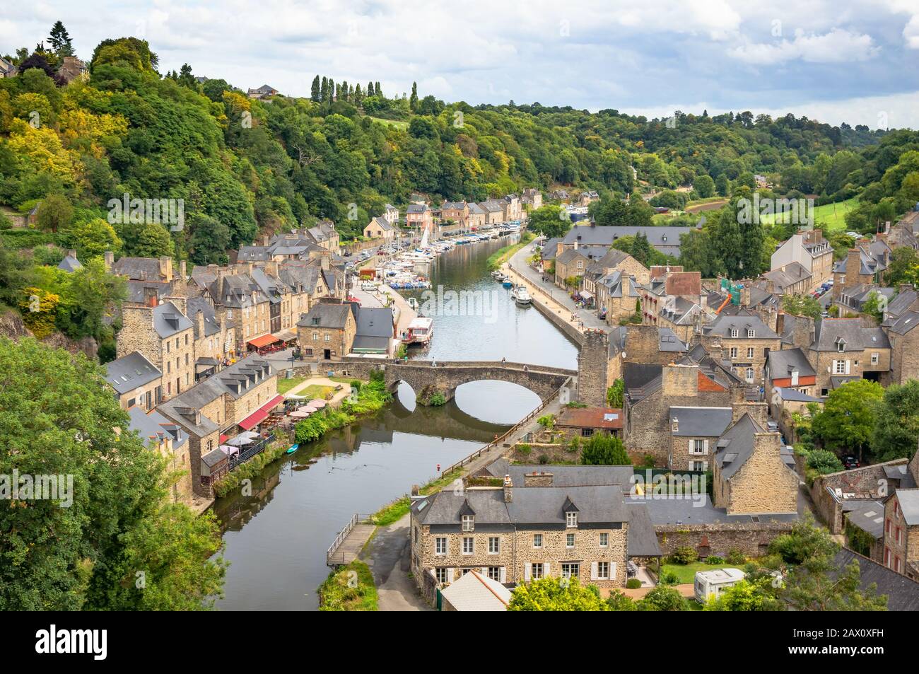 Beautiful aerial view of the historic town of Dinan with Rance river on a sunny summer day with dramatic cloudscape, Cotes-d'Armor, Bretagne, France Stock Photo