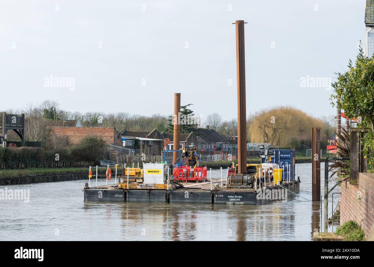 Arundel tidal defence scheme works using jack-up barge & industrial floating platforms on the River Arun in Arundel, West Sussex, England, UK. Stock Photo