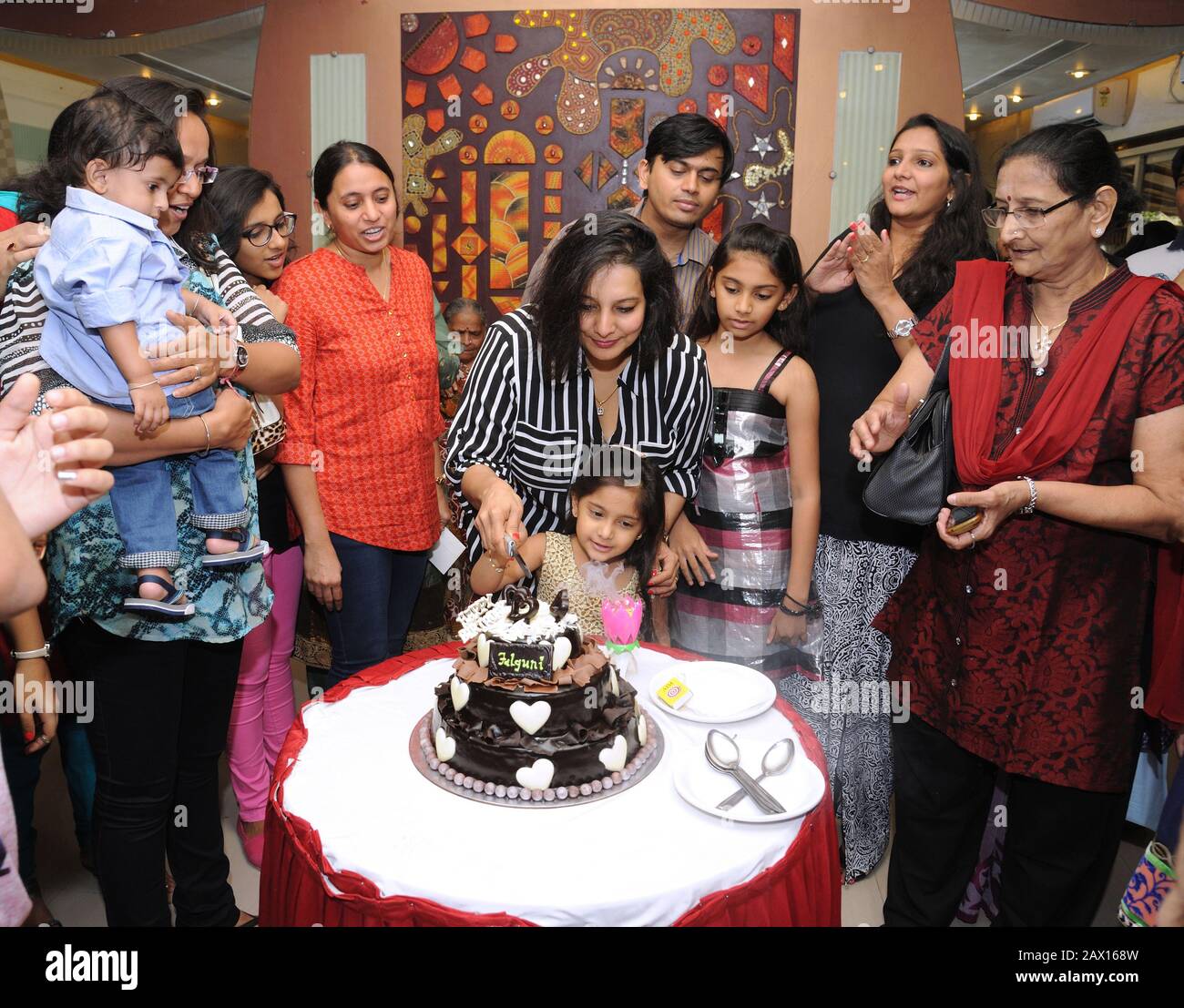 Mumbai, Maharashtra, India- Asia, March. 04, 2016 - Group Indian Family and friends celebrating birthday party Stock Photo
