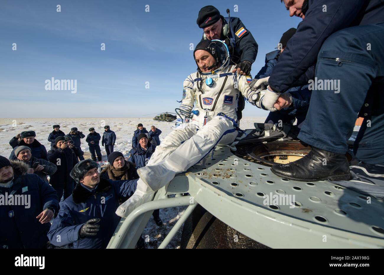 Roscosmos cosmonaut Alexander Skvortsov is helped out of the Soyuz MS-13 spacecraft just minutes after he, ESA astronaut Luca Parmitano, and NASA astronaut Christina Koch, landed aboard the Russian Soyuz MS-13 spacecraft in a remote area February 6, 2020 near the town of Zhezkazgan, Kazakhstan. Stock Photo