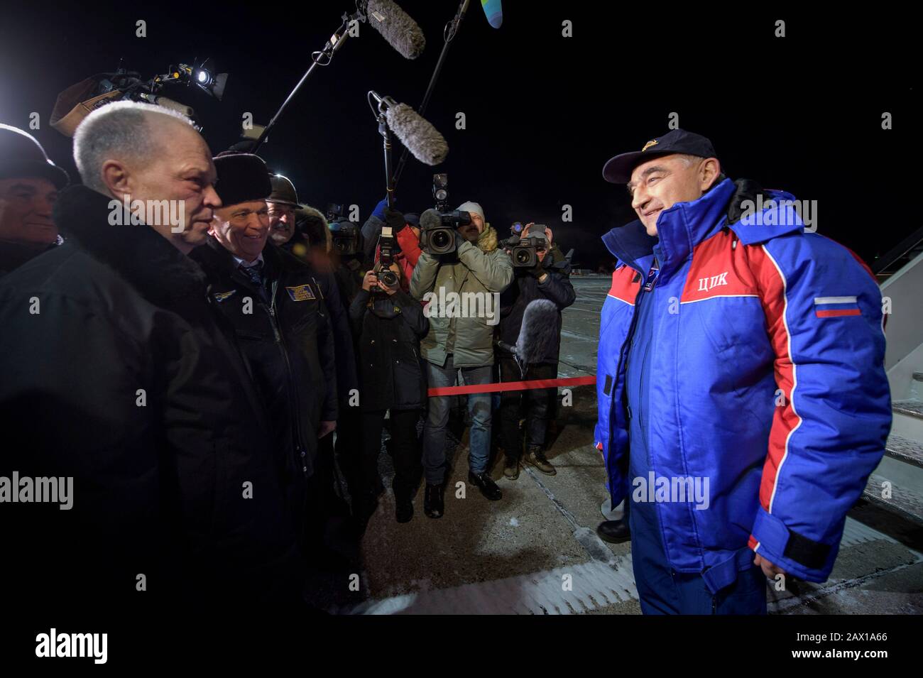 Roscosmos cosmonaut Alexander Skvortsov, right, speaks with the media after arriving at the Karaganda Airport welcome ceremony February 6, 2020 in Zhezkazgan, Kazakhstan.Skvortsov landing aboard the Soyuz MS-13 spacecraft with fellow crew members, ESA astronaut Luca Parmitano, and NASA astronaut Christina Koch Stock Photo