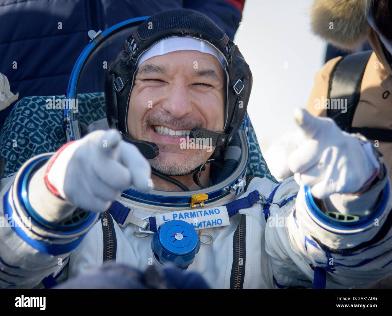 ESA astronaut Luca Parmitano reacts after he was helped out of the Soyuz MS-13 spacecraft just minutes after he, Roscosmos cosmonaut Alexander Skvortsov, and NASA astronaut Christina Koch, landed aboard the Russian Soyuz MS-13 spacecraft in a remote area February 6, 2020 near the town of Zhezkazgan, Kazakhstan. Stock Photo
