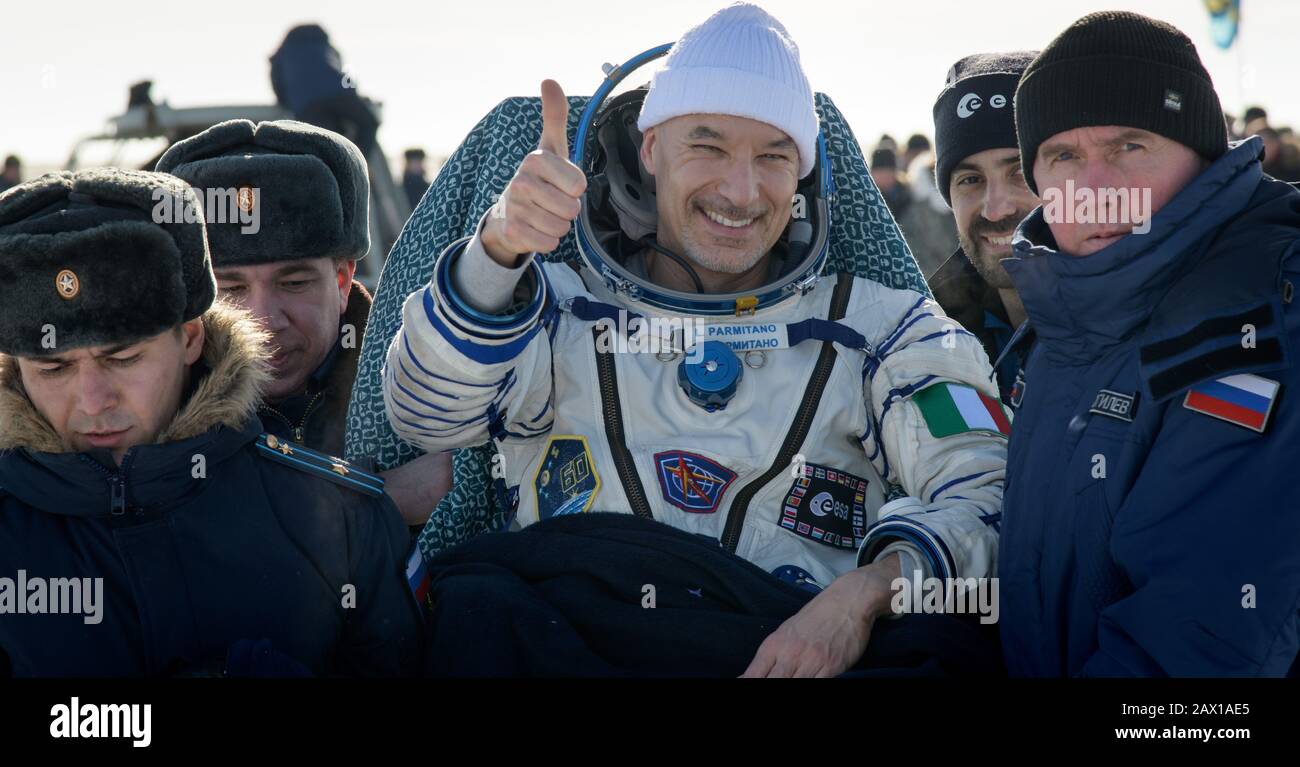 ESA astronaut Luca Parmitano is helped out of the Soyuz MS-13 spacecraft just minutes after he, Roscosmos cosmonaut Alexander Skvortsov, and NASA astronaut Christina Koch, landed aboard the Russian Soyuz MS-13 spacecraft in a remote area February 6, 2020 near the town of Zhezkazgan, Kazakhstan. Stock Photo