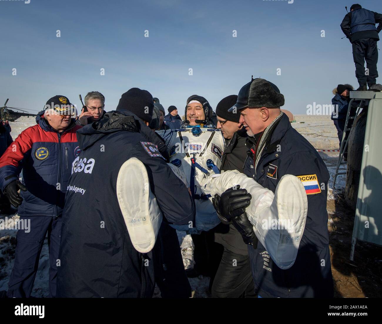 ESA astronaut Luca Parmitano is helped out of the Soyuz MS-13 spacecraft just minutes after he, Roscosmos cosmonaut Alexander Skvortsov, and NASA astronaut Christina Koch, landed aboard the Russian Soyuz MS-13 spacecraft in a remote area February 6, 2020 near the town of Zhezkazgan, Kazakhstan. Stock Photo