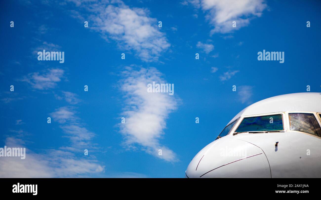 Cockpit of jet airliner with blue skies Stock Photo