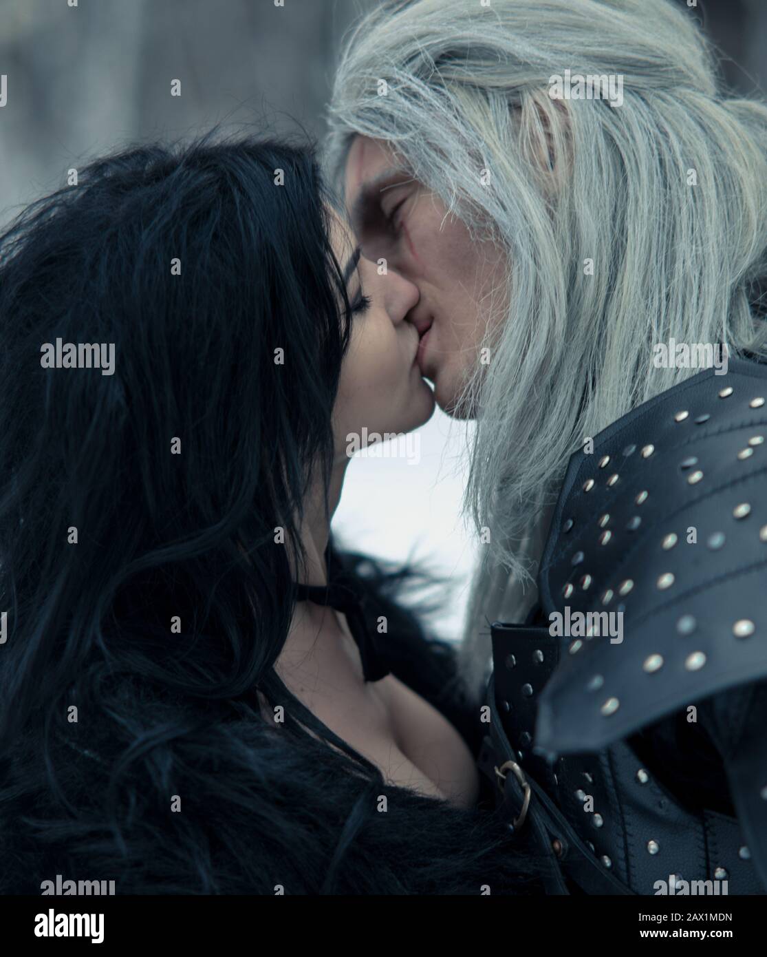 Couple kiss in image of ancient warrior witcher and witch. Stock Photo