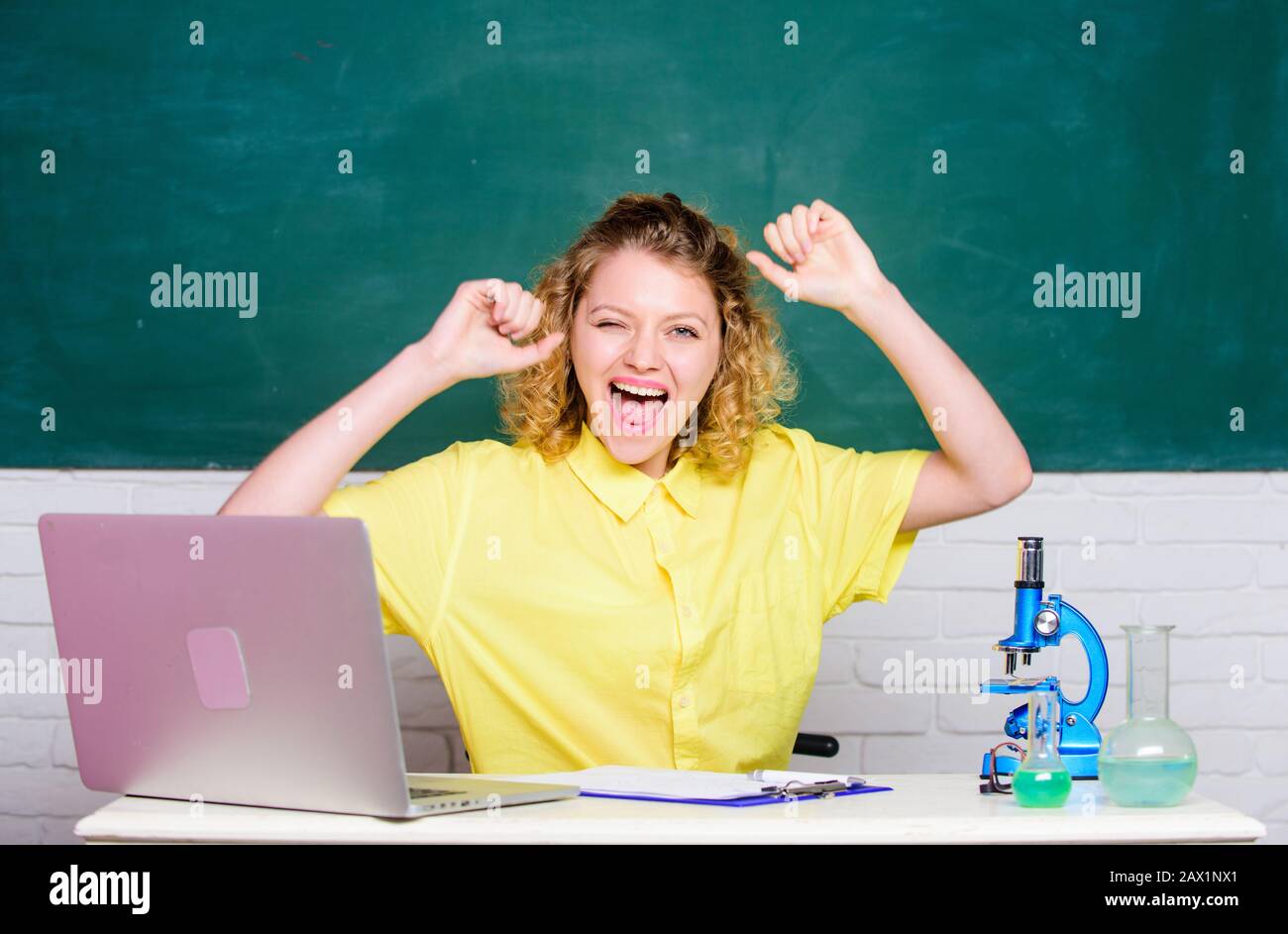 yes finally. scientist teacher at school lab. girl in classroom