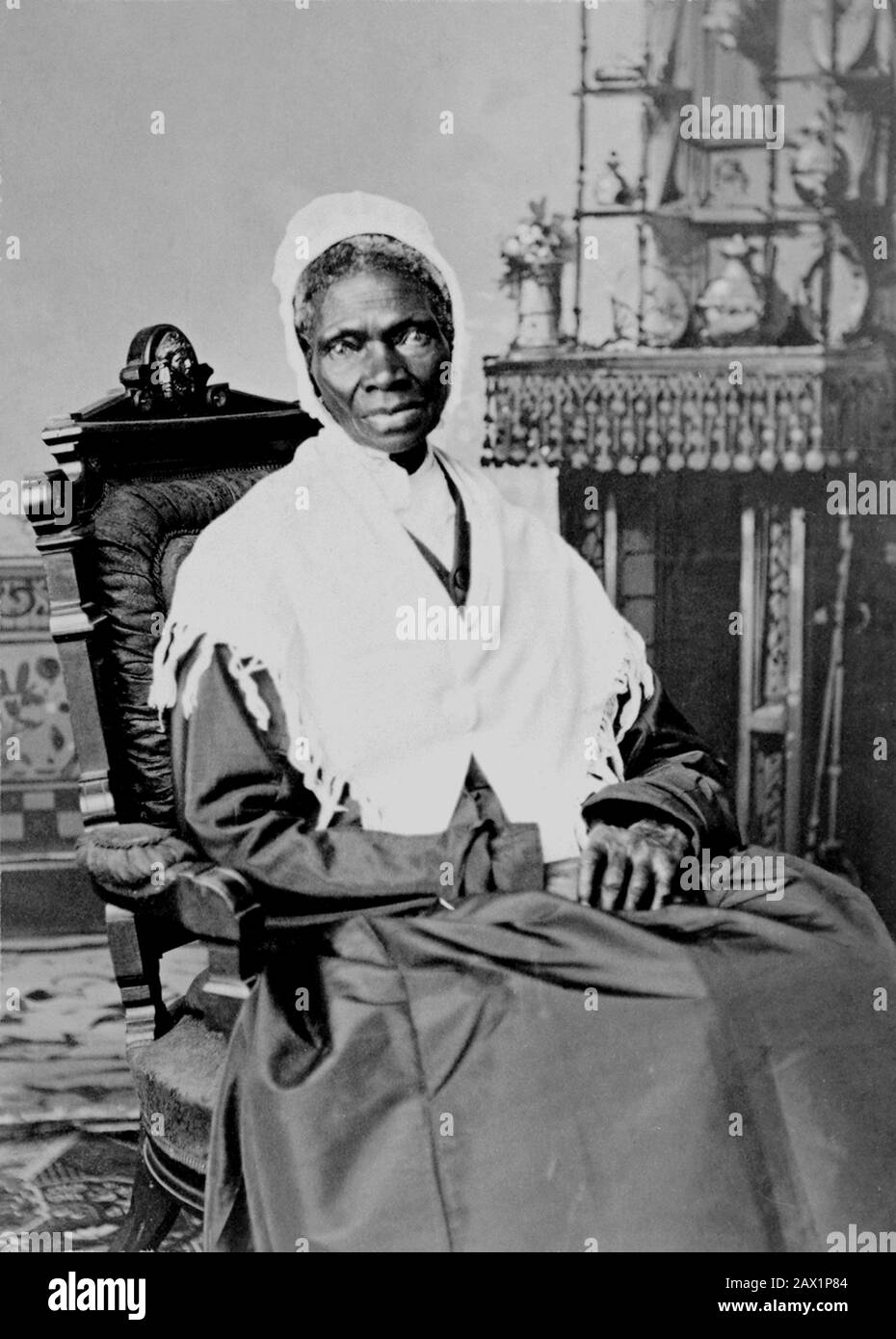 1870 , USA : Portait of Sojourner Truth  , photo by Randall Studio , 1870. The U.S.A. President ABRAHAM LINCOLN ( 1809 - 1865 ) showing Sojourner Truth ( Isabella Baumfree , 1797 - 1883 ) the Bible presented by colored people of Baltimore ,  Executive Mansion , Washington , D.C., Oct. 29, 1864 . Sojourner Truth was the self-given name, from 1843 onward, of Isabella Baumfree, an African-American abolitionist and women's rights activist. Truth was born into slavery in Swartekill, Ulster County, New York, but escaped with her infant daughter to freedom in 1826. After going to court to recover her Stock Photo