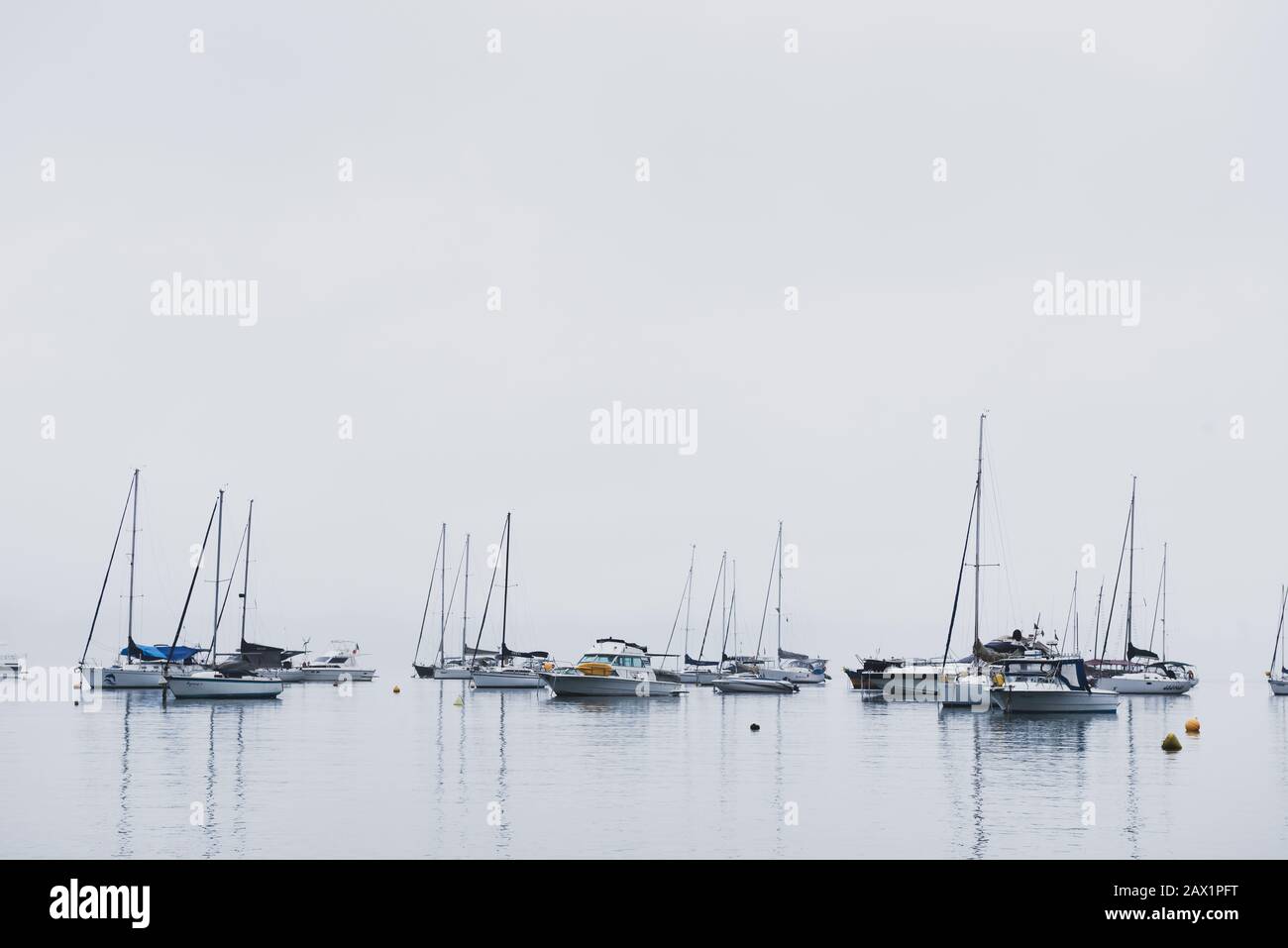 Boats moored during a misty cloudy day at Ilhabela, São Paulo, Brazil Stock Photo
