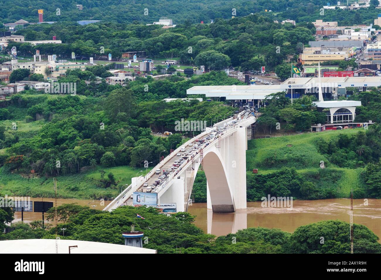Aerial view of traffic crossing the Friendship Bridge (Portuguese: Ponte da Amizade), connecting Foz do Iguacu, Brazil, to Ciudad del Este, Paraguay. Stock Photo