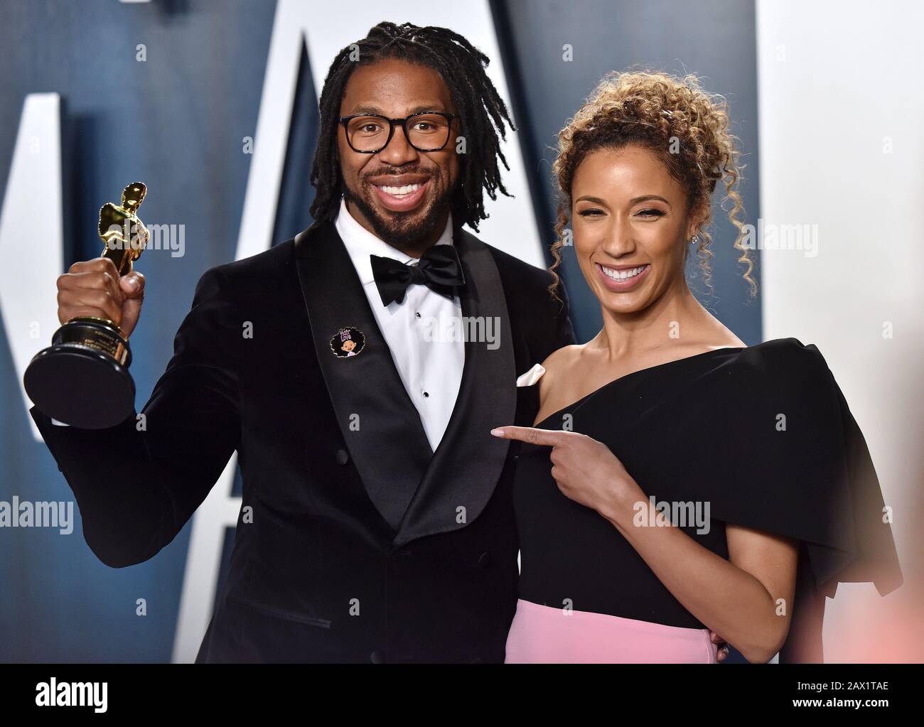 Beverly Hills, United States. 10th Feb, 2020. Director Matthew A. Cherry (L) holds his Oscar for Best Animated Short as he and a guest arrive for the Vanity Fair Oscar party at the Wallis Annenberg Center for the Performing Arts in Beverly Hills, California on February 9, 2020. Photo by Chris Chew/UPI Credit: UPI/Alamy Live News Stock Photo