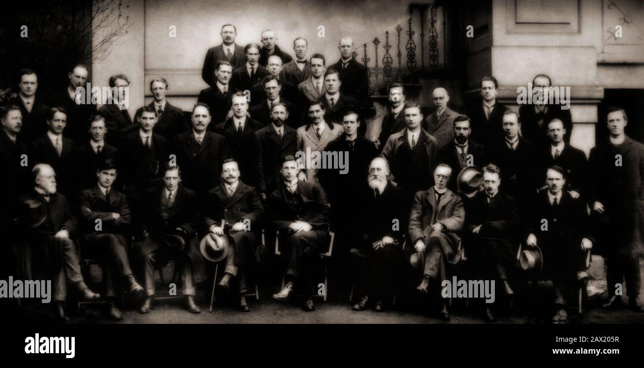 Members of the first Dail in 1919, with Michael Collins (second left front) and Eamon de Valera (fifth left front). This Dáil was an assembly established by Sinn Féin MPs elected to the House of Commons of the United Kingdom in the 1918 general election. Upon winning a majority of Irish seats in the election, Sinn Féin MPs refused to recognise British parliament and instead convened as the First Dáil Éireann (translated as 'Assembly of Ireland'): the first Irish parliament to exist since 1801. The first meeting occurred in Dublin on 21 January 1919, in the Mansion House. Stock Photo