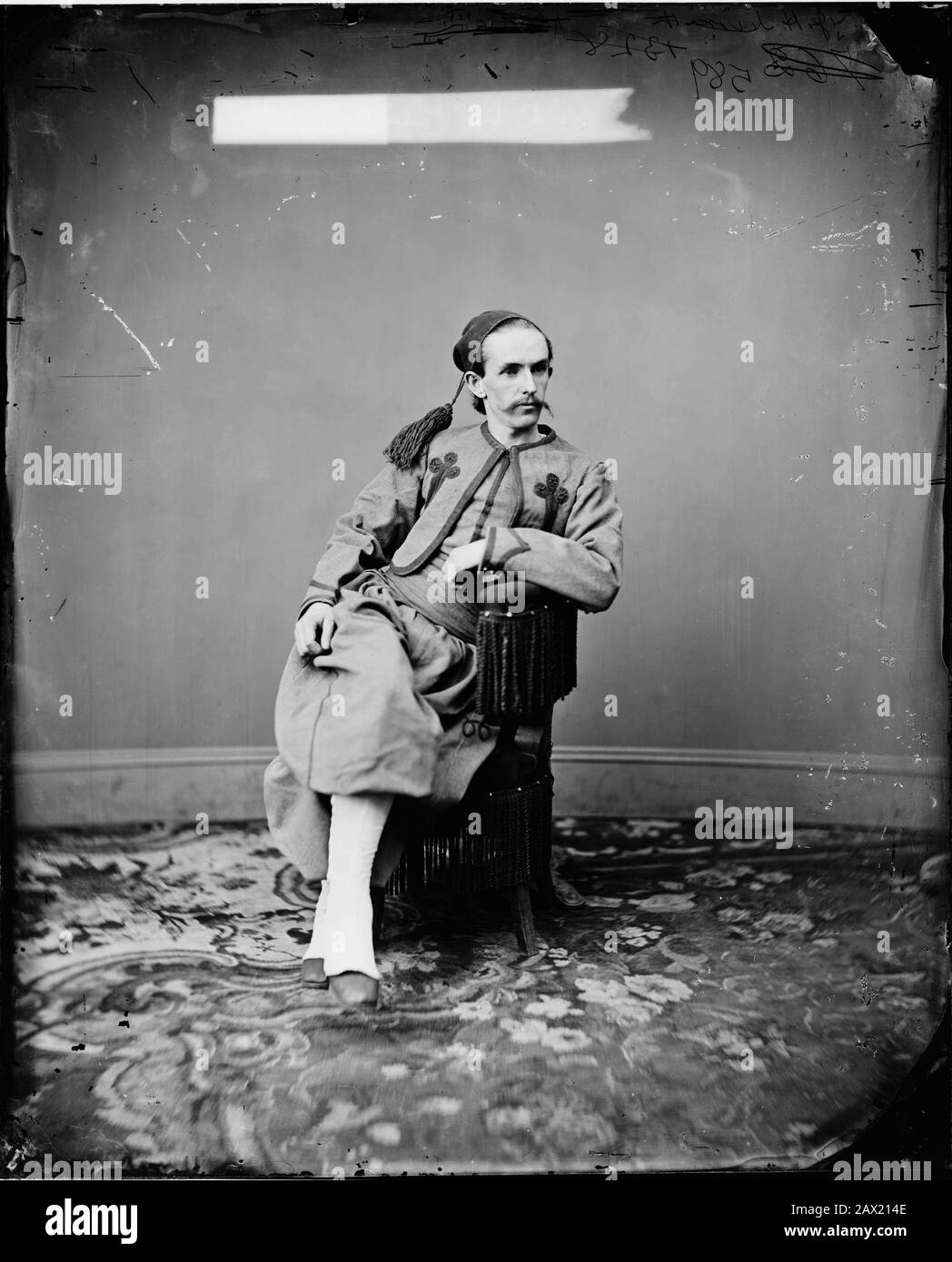 1868, USA : JOHN H. SURRATT Jr ( 1844 - 1916 ) dressed like in Papal Zouave uniform   . Son of MARY SURRATT ( 1820 - 1865 ) the woman reputed one of  U.S.A. President ABRAHAM LINCOLN ( 1809 - 1865 ) conspirators and sentenced to death by hanging . Photographed by Matthew Brady of Brady & Co. John Harrison Surratt  Jr. avoided arrest immediately after the assassination by fleeing the country. He served briefly as a Papal Zouave in ITALY before his arrest and extradition. By the time he returned to the United States the statute of limitations had expired on most of the potential charges and he w Stock Photo