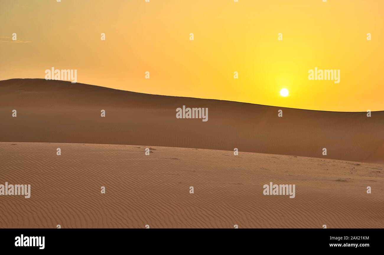 Desert sunset and sand dunes in wahiba Sands, oman Stock Photo