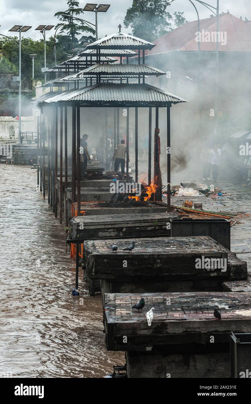 Funeral pyres are tended for many hours until cremated corpses are