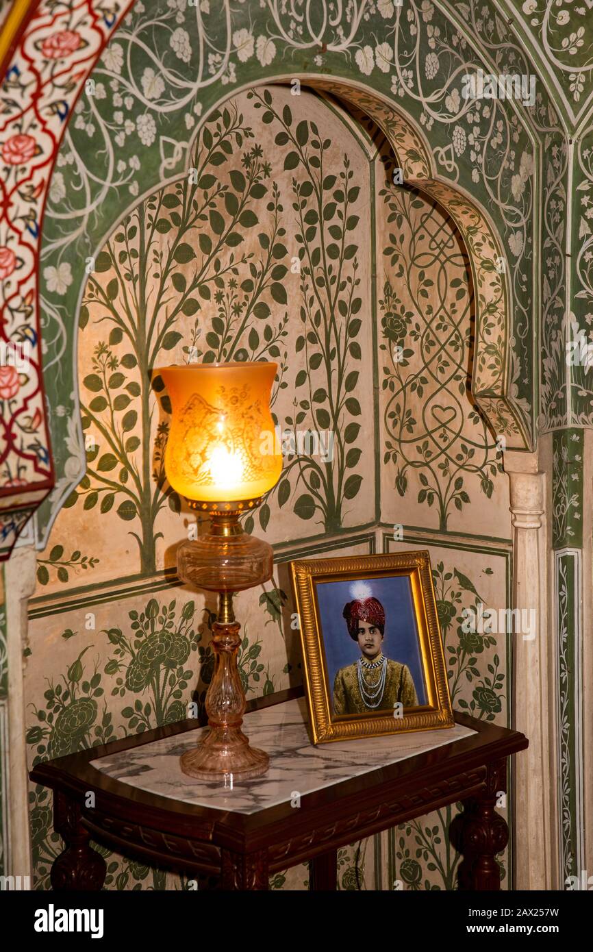 India, Rajasthan, Jaipur, Gangapole, Samode Haveli Hotel, in townhouse of Samode Royal Family, lamp in ornately decorated former dining room Stock Photo