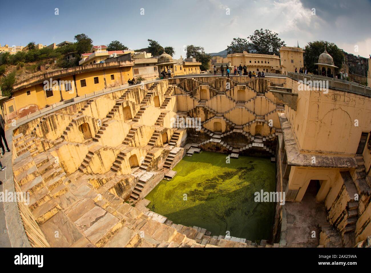 India, Rajasthan, Jaipur, Amber, Panna Meena Ka Kund, C16th baori, step well, geometric symmetrical steps down to water fish eye wide angle lens view Stock Photo