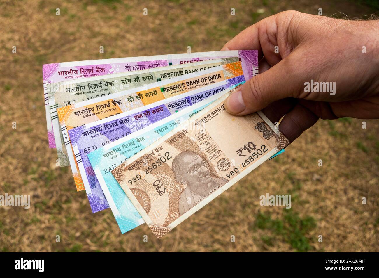 India, hand holding all 2020 Indian currency Rupee Banknotes Stock Photo