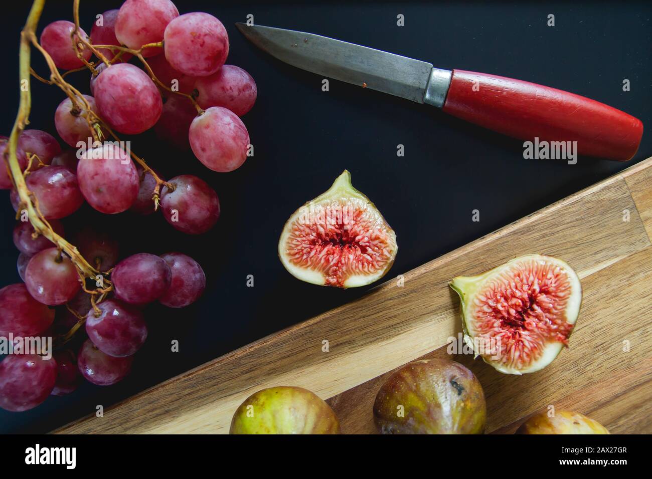 Fresh grapes and figs on the kitchen table Stock Photo