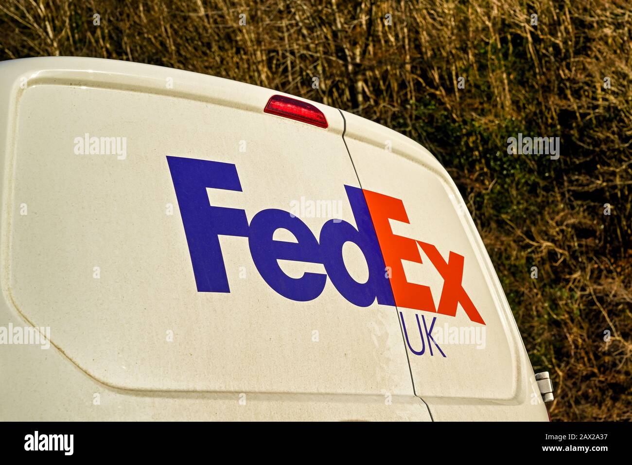CARDIFF, WALES - JANUARY 2020: Close up of the FedEx logo on a delivery van parked on a road near Cardiff Stock Photo