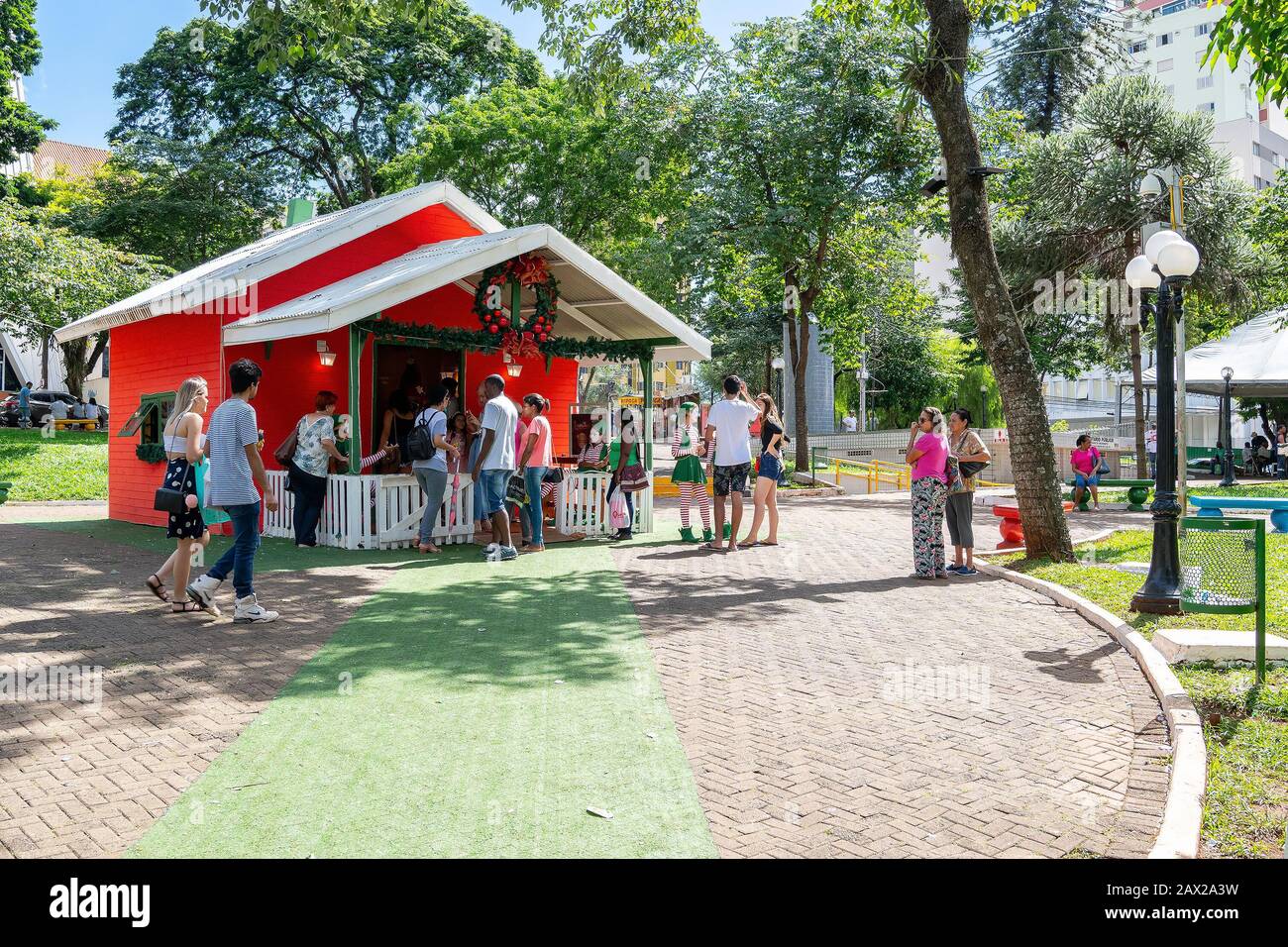 Londrina PR, Brazil - December 23, 2019: Santa Claus house being visited by people at Praca da Bandeira Square during christmas month. Stock Photo