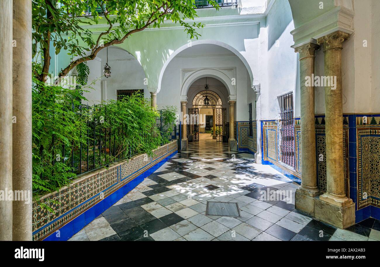 Colorful and elegant moorish cloister in Seville. Andalusia, Spain. Stock Photo