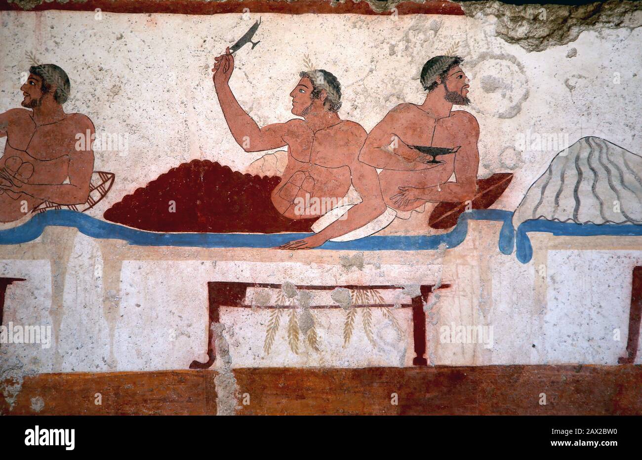 Tomb of the diver, North wall fresco. Detail. Drinking feast scene with men. 480 BC. Greek Art. Paestum Archaeological Museum,  Italy. Stock Photo
