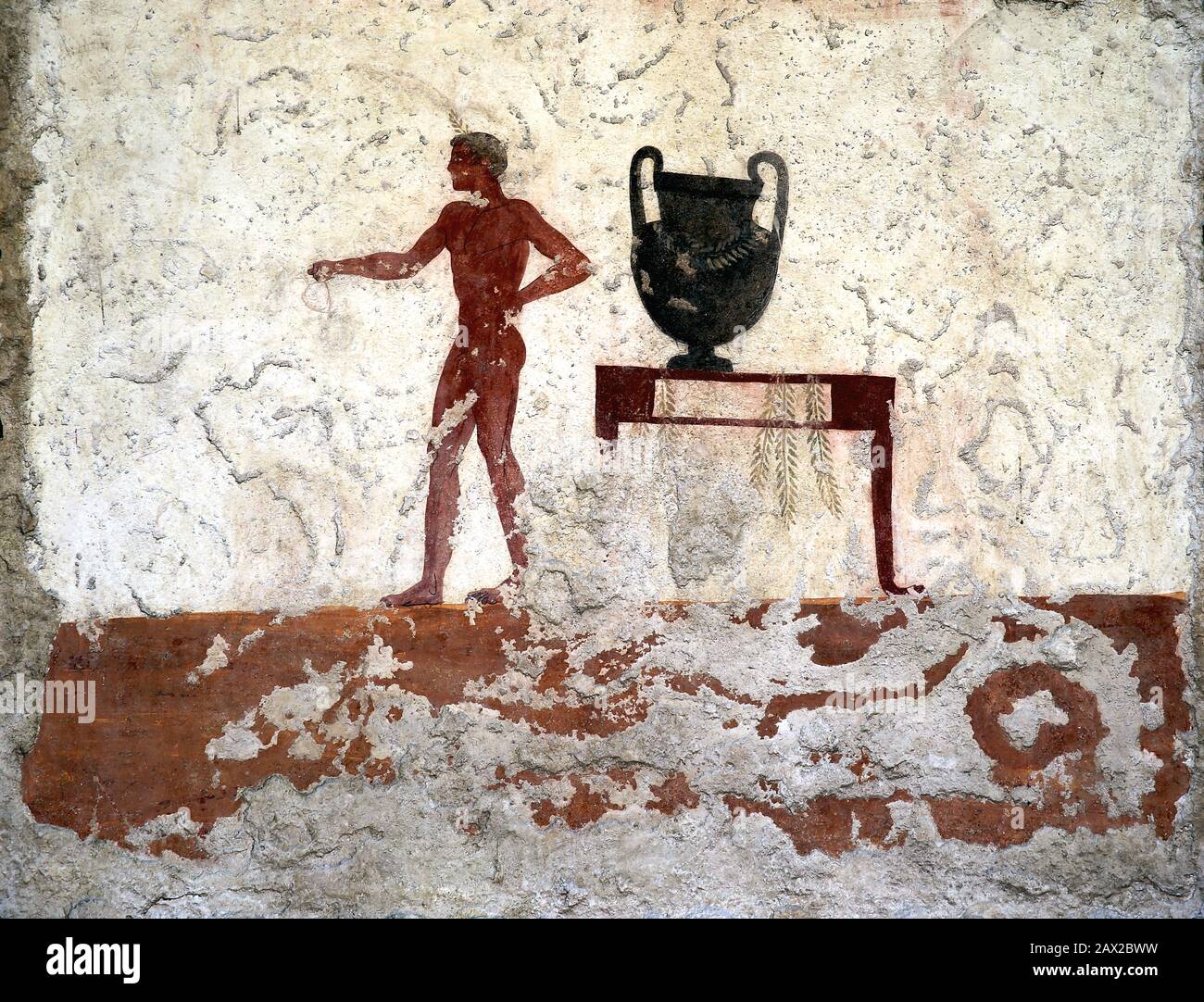 Tomb of the diver, East wall fresco. Scene with nude man holding a drinking cup. C. 480 BC. Greek Art. Paestum Archaeological Museum. Stock Photo