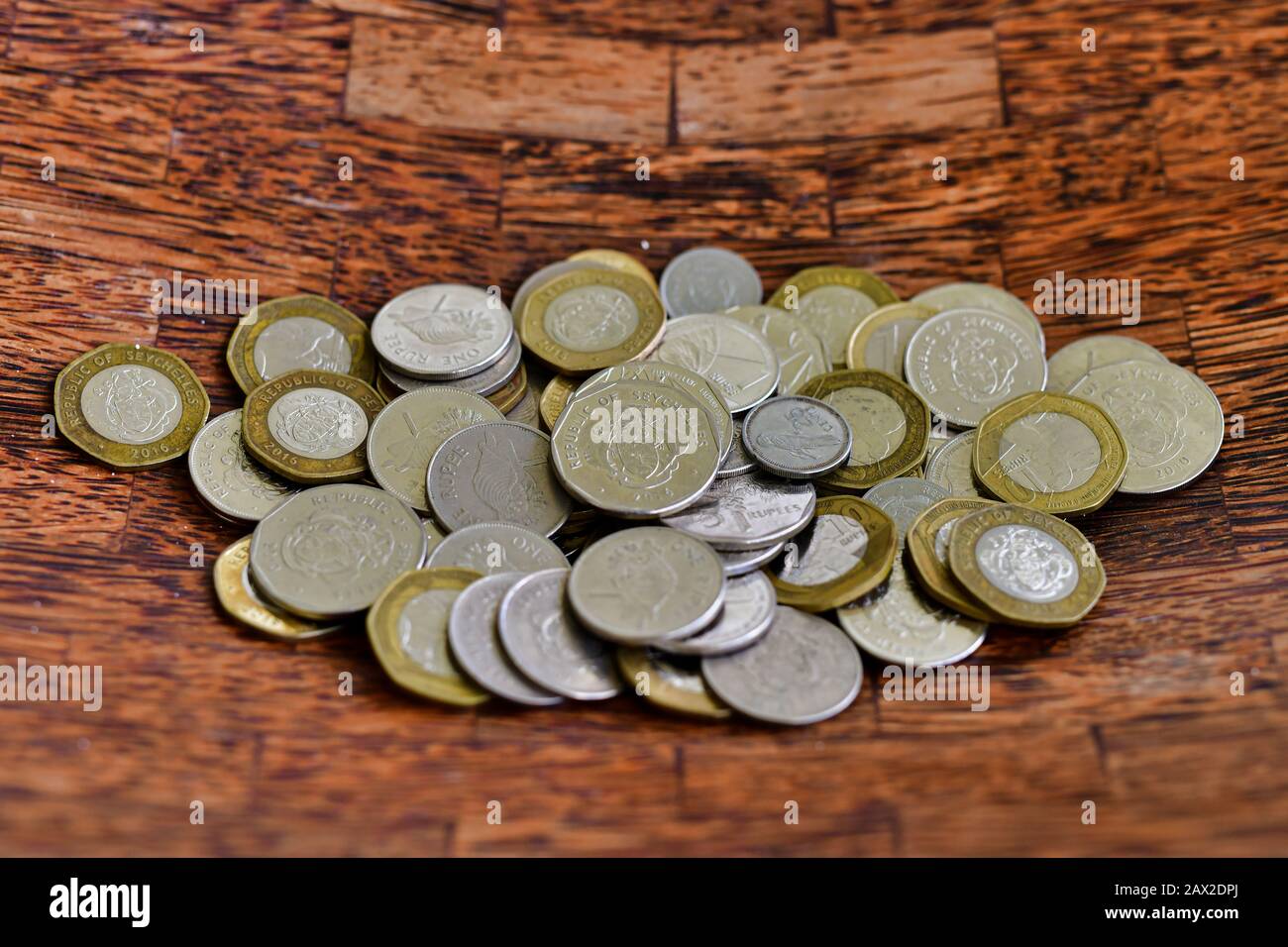 Seychelles Rupees, 2020, coins with wooden background. Stock Photo